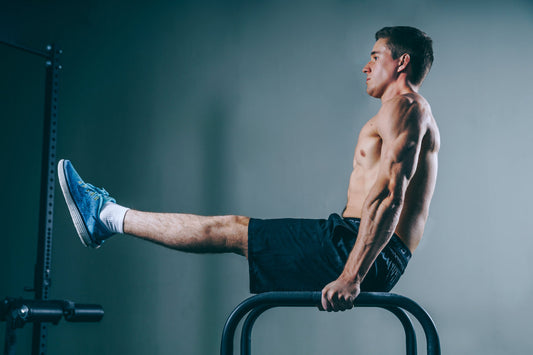 Image of male at gym without shirt, muscles. Core exercises. 